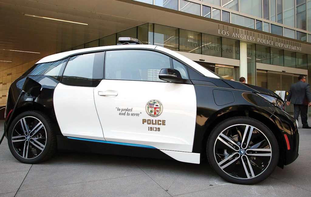 Los Angeles City Mayor Eric Garcetti and Los Angeles Police Department Chief Charlie Beck announce a year long test of a BMW i3 electric vehicle at a City of Los Angeles press conference in Los Angeles, Sept. 11, 2015. Photo by Danny Moloshok/Newscast